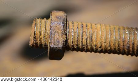 Old Rusty Bolt, Iron Rod With Screw Threads. Rusted Mechanical Components. Threaded Bolt And Nut Iso