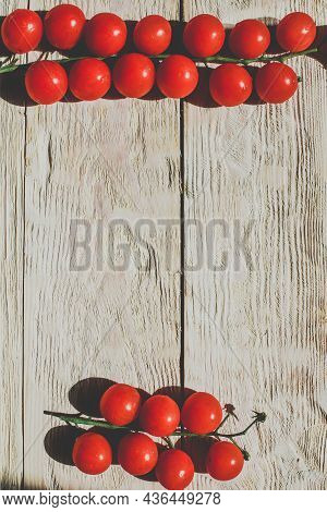 Cherry Tomatoes On Wooden Table Background With Copy Space