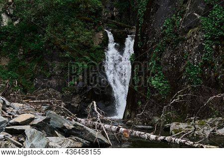 Estyube Waterfall At Lake Teletskoye In The Altai Mountains.