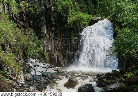 Estyube Waterfall At Lake Teletskoye In The Altai Mountains.