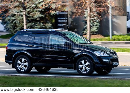 Moscow; Russia - October 14; 2021: Black Ssangyong Kyron  Is Driving Fast On The Street On A Warm Au
