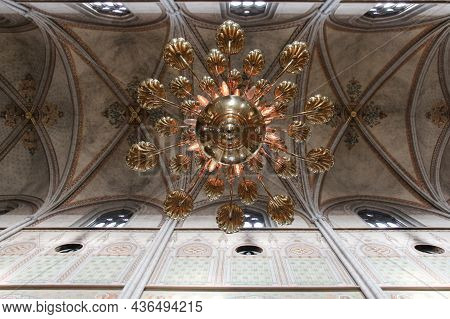 Sweden, Uppsala - April 19 2019: Interior View Of Uppsala Cathedral, Chandelier On A Vaulted Ceiling