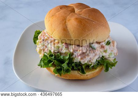 Turkey Salad Sandwich With Lettuce, Green  Onions, And Celery On A Bun