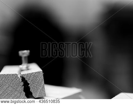 Selective Focus On Cracked And Split Wood From Not Drilling A Pilot Hole Before Driving A Screw