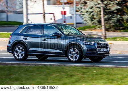 Moscow; Russia - October 14; 2021: Black Audi Q5  Is Driving Fast On The Street On A Warm Autumn Day