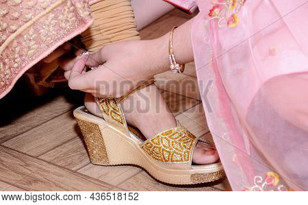 A Bride Wearing Silver Metal Adornment Bracelet (anklets) On Feet