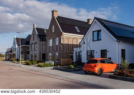 Newly Build Houses With Solar Panels Attached On The Roof Against A Sunny Sky Close Up Of New Buildi