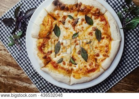 Close-up Of Margarita Pizza In A Disposable Dish. Top View Of Takeaway Food In A Fast Food Cafe. On