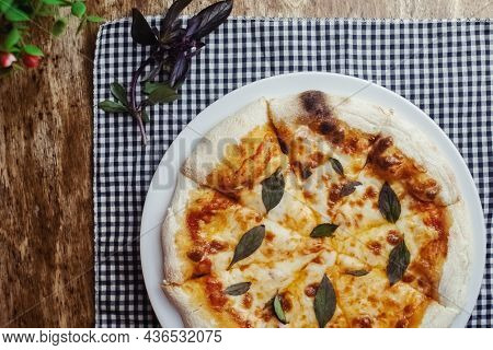 Close-up Of Margarita Pizza In A Disposable Dish. Top View Of Takeaway Food In A Fast Food Cafe. On