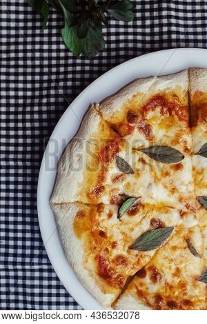 Close-up Of Margarita Pizza In A Disposable Dish. Top View Of Takeaway Food In A Fast Food Cafe. On