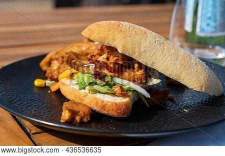 Italian Ciabata Bread Served With Fresh Salade And Vegan Fried Chicken In Pieces