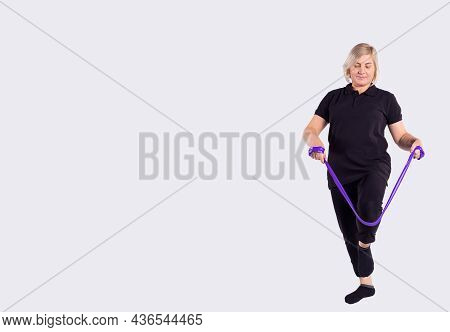 Squat With Resistance Band Row. Quadriceps Training. Senior Woman Exercises At Home. Fitness, Squatt