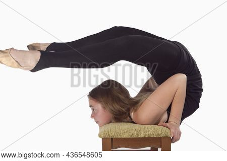 Sport Ideas And Concepts. Young Caucasian Rhythmic Gymnast Sportswoman In Training Outfit During Bac