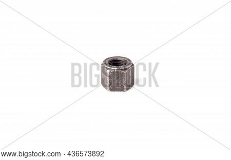 One Macro Metallic Nut Isolated On White Background. Heavy Hex Nut. Female Screw Nut With Copy Space