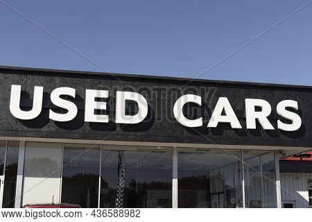 Used Car Sign At A Pre-owned Car Dealership. As Supplies Of New Cars Dwindle, Used Cars Become More 