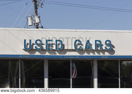 Used Car Sign At A Pre-owned Car Dealership. As Supplies Of New Cars Dwindle, Used Cars Become More 