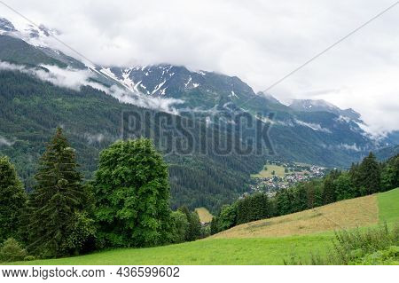 Panoramic View On Mountain Villages, Green Forests And Apline Meadows Near Saint-gervais-les-bains,