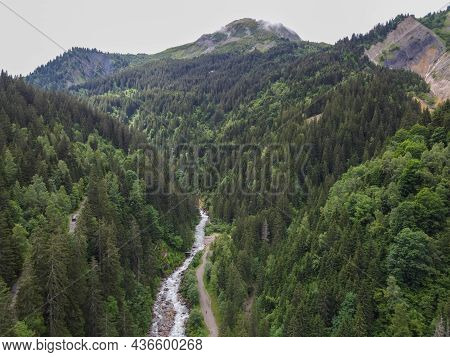 Panoramic View On Green Alpine Spruce And Pine Tree Forests And Meadows Near Saint-gervais-les-bains