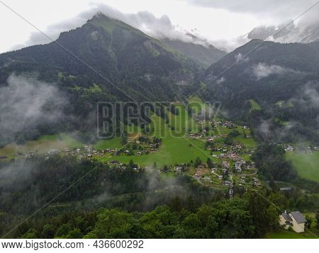 Panoramic View On Mountain Villages, Green Forests And Apline Meadows Near Saint-gervais-les-bains,