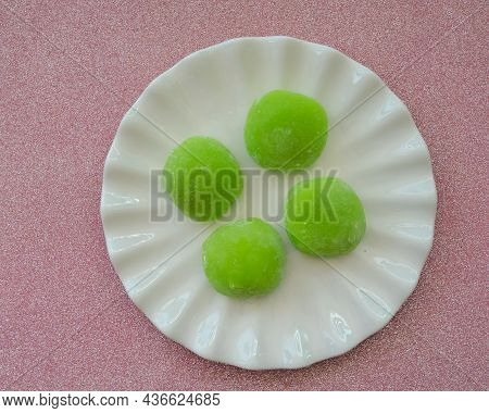 Japanese Dessert With Malaysian Fusion, Pandan Mochi In Green Colour On A White Plate With Chopstick