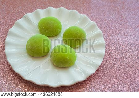 Japanese Dessert With Malaysian Fusion, Pandan Mochi In Green Colour On A White Plate With Chopstick