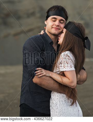 Romantic Couple Blindfolded With Black Ribbon. Love Blind Concept