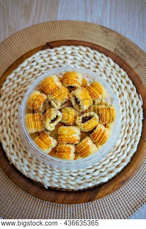 Traditional Pineapple Jam Tart Roll Cookies Or A Malay Called Tart Nanas In A Plastic Container.