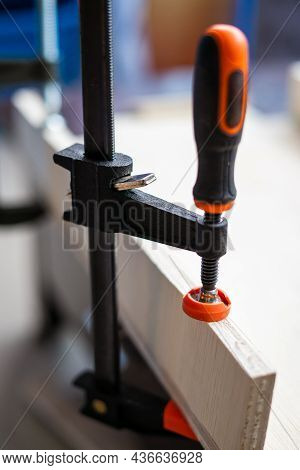 Wood Working. Fine Quality Hardwood Lumber, Ready For Use. F-clamp Holding On Lumber.
