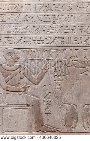 Egyptian Hieroglyphs And Ancient Drawings On Clay Tablets And Papyri Background. The Art Of Egypt An