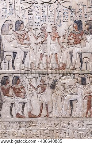 Egyptian Hieroglyphs And Ancient Drawings On Clay Tablets And Papyri Background. The Art Of Egypt An