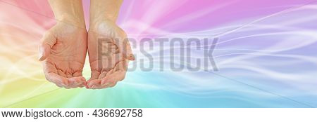 Sending Out Multicoloured Healing Energy Message Banner - Female Cupped Hands Against A Rainbow Colo