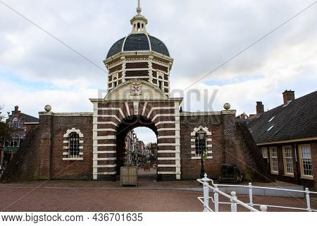 Cityscape Of Leiden, The Netherlands. View Of New Rhine River And Dutch Houses.