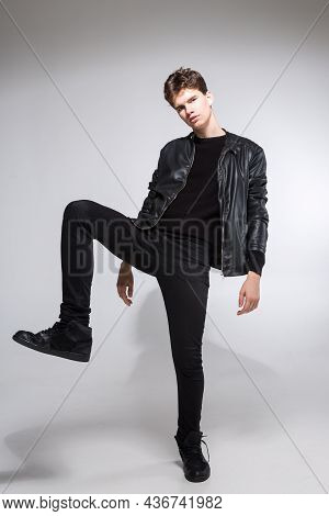 Full Body Image Of Model Appearance Of Young Fashionable Guy In Leather Jacket And All Black Clothes