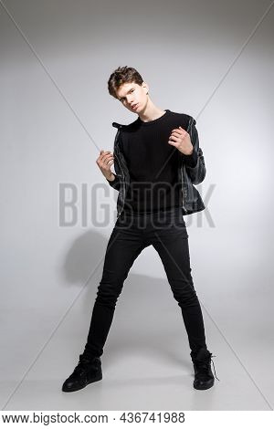 Full Body Image Of Model Appearance Of Young Fashionable Guy In Leather Jacket And All Black Clothes