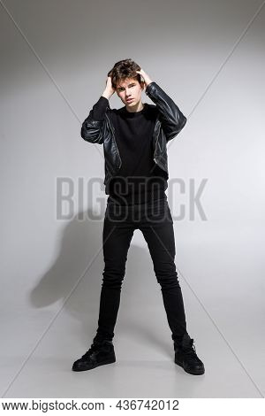 Full Body Image Of Model Appearance Of Young Fashionable Guy In Leather Jacket And All Black Clothes