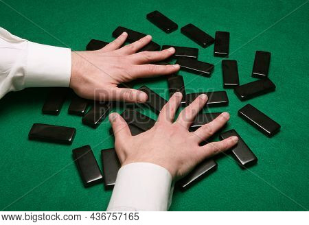 Dealer Shuffling Pai Gow Tiles On Green Felt Table