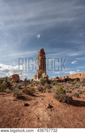 Wid Shot Of Dark Angel Standing Tall At The End Of Trail In Arches National Park