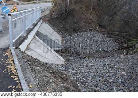 Automobile And Pedestrian Small Bridge Over A Small River.