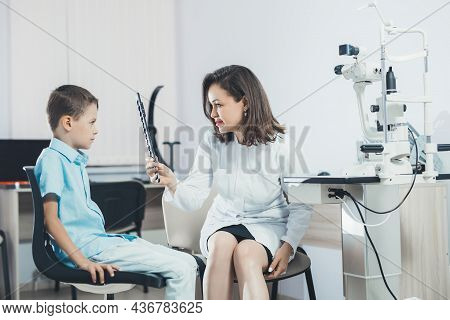 Ophthalmologist Checks The Boy's Vision. Hyperopia. Vision Tests In Children.