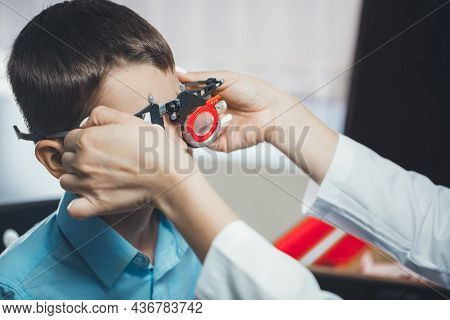 Ophthalmologist Checks The Boy's Vision. Hyperopia. Vision Tests In Children.
