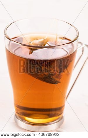 Steeping A Herbal Tea Bag In A Glass Tea Mug Close Up