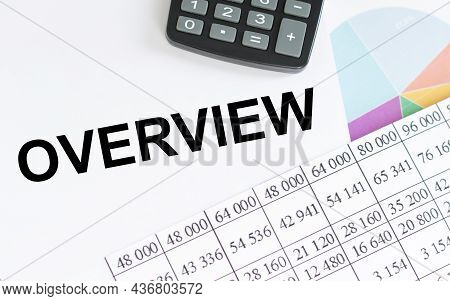 Text Overview On White Notepad Among Reports On The Table