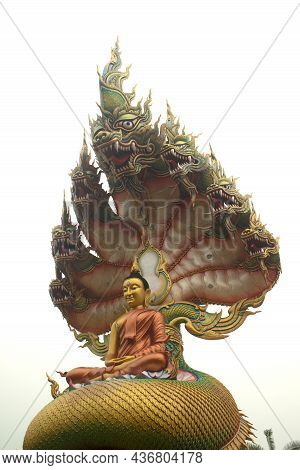 Sakon Nakhon,thailand - October 1 , 2020 : A Large Golden Seated Buddha Statue Outdoors, Sheltered B