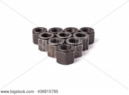 Stack Of Metallic Nuts Isolated On White Background. Heavy Hex Nut. Female Screw Nut With Copy Space