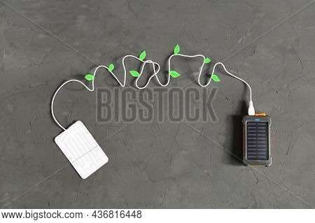 Portable Heater Is Connected By Wire With Usb To Connector Power Bank With Solar Panel On Gray Textu