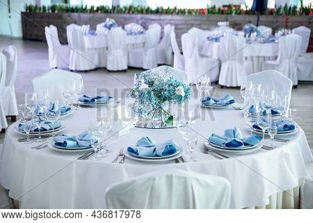 The Banquet Hall With Round Tables. Restaurant Banquet Hall With Served Decorated Wedding Tables. Ro