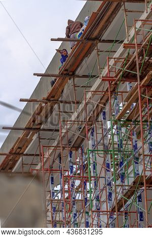Several Male Workers On The Construction Of A High-rise Building Around The Simpang Lima Boyolali Ci