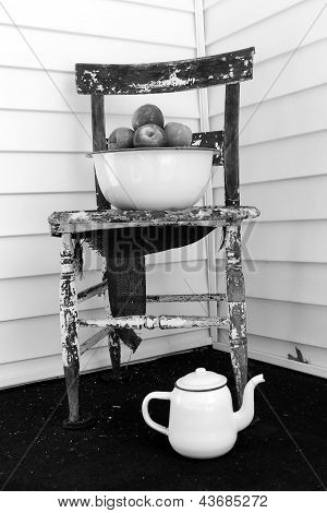 Old wood chair with bowl of fruit