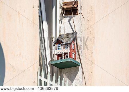 Jawor, Poland - August 08, 2021. Cute Tiny Birdhouse Behind The Window