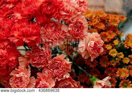 Bunches of orange flowers in a flower shop